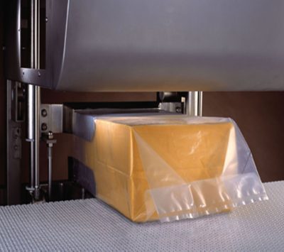 block of cheese on conveyor belt